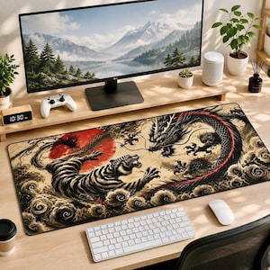 May include: A rectangular desk mat featuring a detailed illustration of a tiger and a dragon in a dynamic pose against a large red sun. The artwork includes swirling clouds and dark, intricate patterns on a beige background, covering the desk surface.