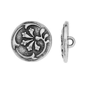 May include: A pair of antique silver-colored buttons. One button is shown face-on, displaying a floral design with curved stems and small flower buds. The other button is shown from the side, revealing a loop for sewing. The buttons have a slightly distressed finish.
