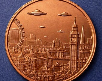 May include: A circular copper-toned medallion featuring a relief of the London skyline, including the Elizabeth Tower and the London Eye, with five flying saucer-shaped objects hovering in the sky above the city buildings in a detailed scene.