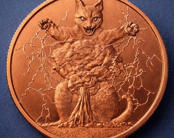 May include: A circular copper-toned coin featuring a relief design of a cat with its mouth open and paws raised. The cat is surrounded by intricate lightning bolt patterns that extend from its body, creating a dynamic and textured metallic surface.