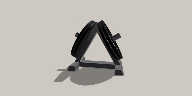 Op de afbeelding: Een zwarte metalen gewichtsplaatstandaard met twee gewichtsplaten die op elkaar zijn gestapeld.