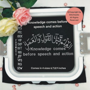 May include: Black embroidery hoop with white stitching around the edge. The hoop contains black fabric with white text that reads "Knowledge comes before speech and action" in English and Arabic. The text is also in a smaller font below the Arabic text. The hoop is on a white surface with pink beads scattered around it.