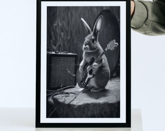 May include: A black and white photo of a rabbit playing an electric guitar in front of an amplifier. The rabbit is sitting on a rock and the guitar is plugged into the amplifier.