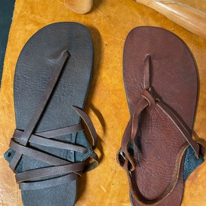 Dark Brown and Tan Sandals side by side