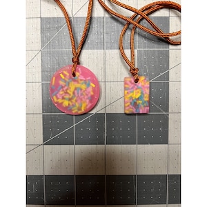 Frosted  glow micro worry stone / pendant. Multiple designs available!