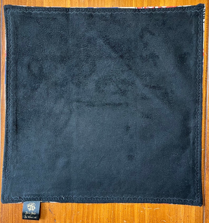 May include: Black velvet dice tray with a colorful floral pattern border. The tray has a label on the bottom that reads "Dice Tray by Oh Sew Crafty".