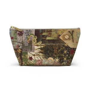 May include: A rectangular cosmetic bag with a patchwork design. The bag features a gold zipper and a variety of images, including a pomegranate, stars, and a forest scene. The overall color palette is muted with earthy tones.