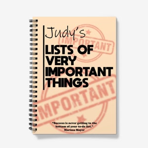 May include: A spiral bound notebook with a peach background and the text "Judy's Lists of Very Important Things" in black. The background has a red "Important" stamp repeated multiple times. The quote "Success is never getting to the bottom of your to-do list." by Marissa Mayer is printed at the bottom.
