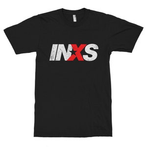 May include: Black t-shirt with a white and red "INXS" logo. The "X" is a red star.