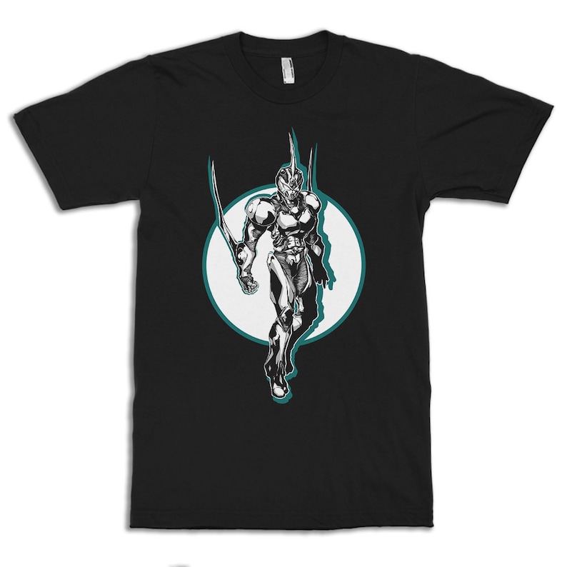 May include: Black t-shirt with a white circle graphic of a black and white character in a futuristic suit with a teal outline.