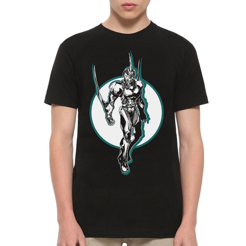 May include: Black t-shirt with a graphic of a character in a white and black suit with a teal circle around it.