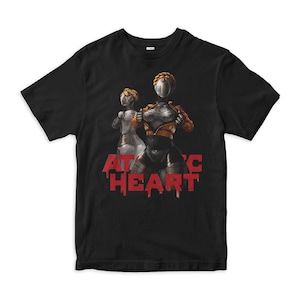 May include: Black t-shirt featuring a graphic of two female robots in front of the text "ATOMIC HEART" in red dripping letters.