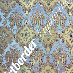 May include: A blue and gold fabric with a repeating pattern of angels holding chalices. The pattern is intricate and includes vines, crosses, and other decorative elements.