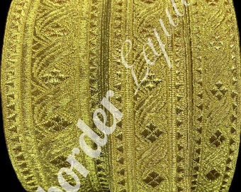 May include: Gold trim with a geometric pattern. The trim is woven and has a subtle sheen.