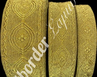 May include: Three gold-colored trim pieces with a geometric pattern. The trim is woven and has a subtle sheen.