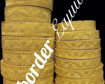 May include: A stack of gold trim with a geometric pattern. The trim is about 1 inch wide and has a fringe edge. The trim is labeled "Artborder & trims".