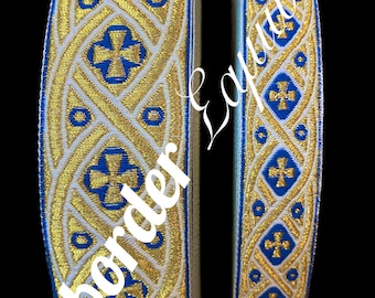 May include: Two rolls of gold and blue trim with a cross pattern. The trim is woven with a white background and gold and blue threads.