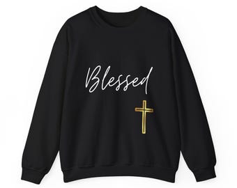 May include: Black sweatshirt with the word "Blessed" in white script and a gold cross.