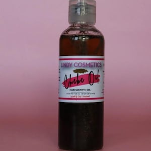 May include: A brown glass bottle with a clear plastic cap. The bottle is labelled "Lindy Cosmetics Chebe Oil Hair Growth Oil 100% Natural Ingredients 3.38 fl Oz | 100ml"