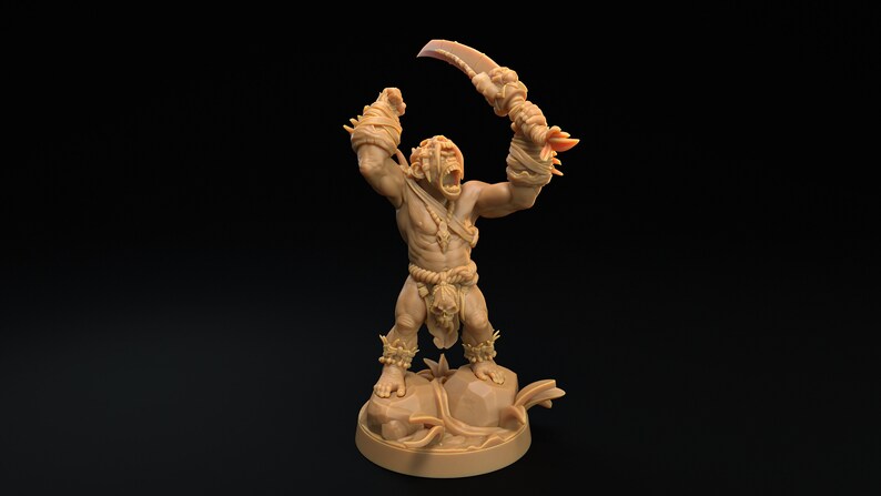 May include: A brown miniature figurine of a humanoid creature with a large, toothy mouth, holding a curved blade in one hand. The creature is wearing a loincloth and has a skull hanging from its waist. The figurine is standing on a base with a rocky texture.