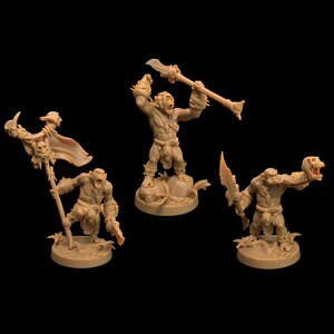 May include: Three miniature plastic figures of orcs, each holding a different weapon. The orcs are painted in a brown color and are standing on circular bases.