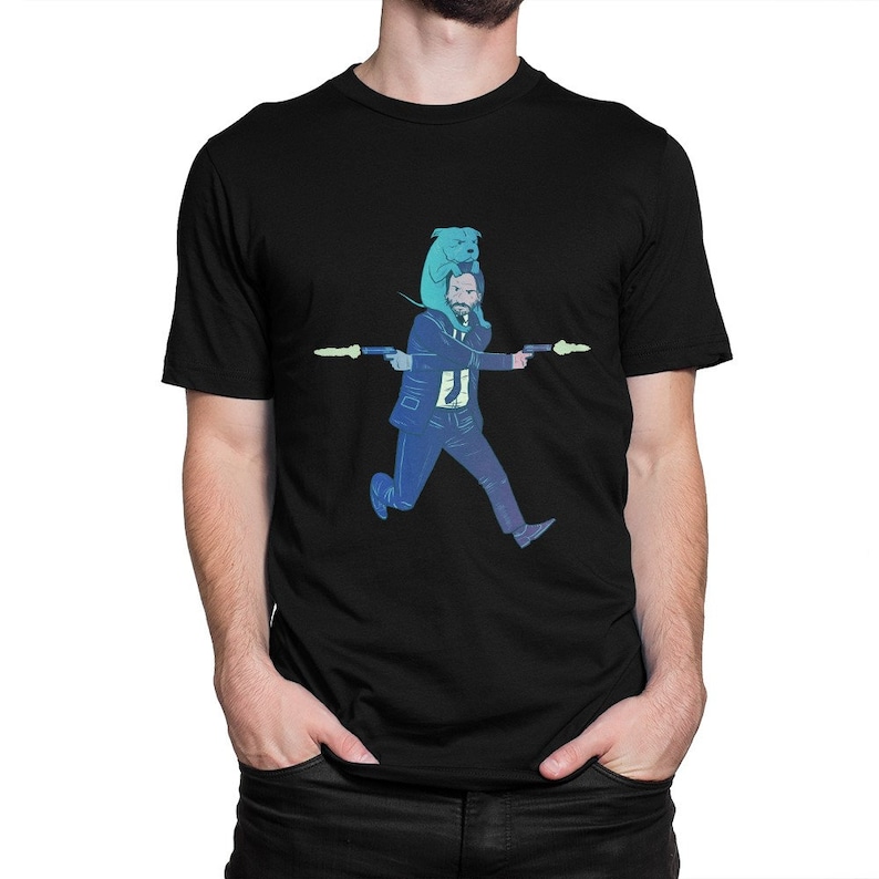 May include: A black t-shirt with a graphic of a man in a suit holding two guns, with a dog on his head. The man and dog are in a blue and green color scheme.