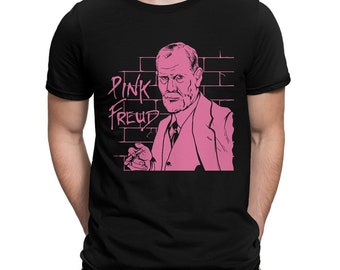 May include: Black t-shirt with a pink graphic of Sigmund Freud with the text "Pink Freud" on a brick wall background.
