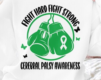 Puede incluir: Sudadera blanca con guantes de boxeo verdes y una cinta verde. El texto "Fight Hard Fight Strong" está por encima de los guantes y "Cerebral Palsy Awareness" está por debajo.