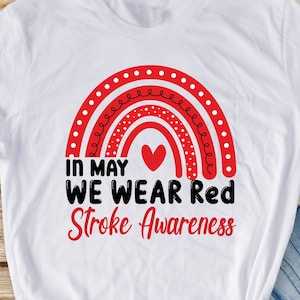 Peut inclure: T-shirt blanc avec un arc-en-ciel rouge et le texte "In May We Wear Red Stroke Awareness".