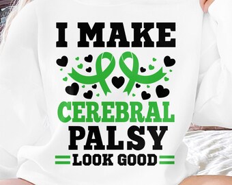 May include: White sweatshirt with the text "I make Cerebral Palsy look good" in black lettering. A green ribbon is featured with black hearts.