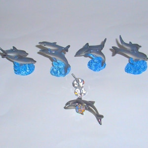 4 Mini DOLPHIN figurines +  1 crystal  dolphin suncatcher