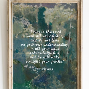 May include: Framed artwork with an abstract, textured background in shades of green, blue, and white. The artwork features a quote in white script: "Trust in the Lord with all your heart..." The frame is a light, distressed wood.