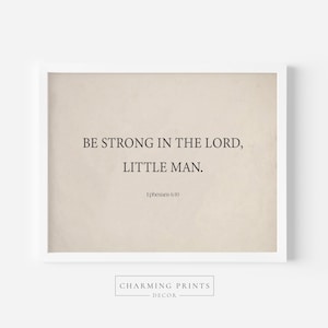 May include: A beige printable wall art print with the text "BE STRONG IN THE LORD, LITTLE MAN." and the scripture reference "Ephesians 6:10".