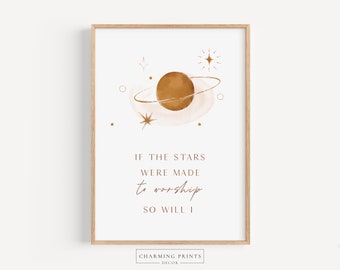 May include: A watercolor print with a brown planet and stars in a white frame. The text reads "If the stars were made to worship so will I."