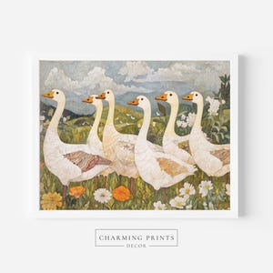 May include: A framed print featuring six white geese with orange beaks, standing in a field of wildflowers. The background shows a landscape with rolling hills and a cloudy sky. The text "CHARMING PRINTS DECOR" is at the bottom.