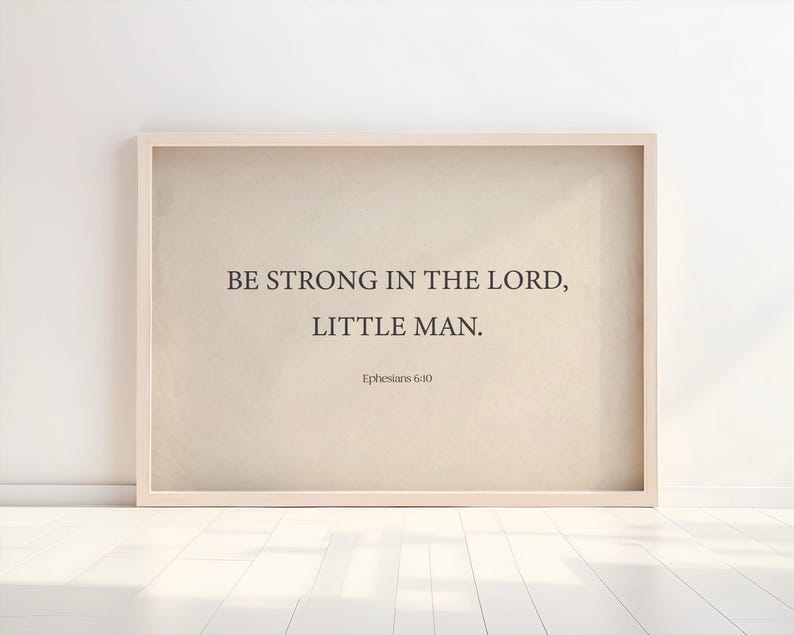 May include: A framed beige canvas print with the text "Be strong in the Lord, little man. Ephesians 6:10"