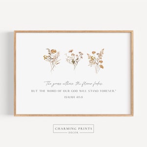 May include: A printable wall art design featuring a beige background with three bouquets of dried flowers and a quote from the Bible: "The grass withers, the flower fades, but the word of our God will stand forever." Isaiah 40:8