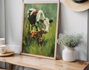 May include: A framed painting of a cow and calf in a green field. The artwork features a light wooden frame and is displayed on a wooden bench. A white vase with flowers and a straw hat are also visible.