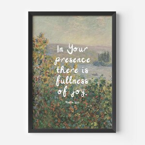 May include: Framed art print featuring a landscape painting with the words "In Your presence there is fullness of joy" in white script. The artwork has a black frame and a serene, colorful background.