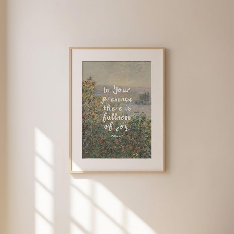 May include: Framed art print featuring a landscape painting with a soft, muted color palette. The artwork includes the text "In Your presence there is fullness of joy." The frame is a light wood color.