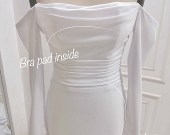 Off-the-shoulder crepe wedding dress. Mermaid wedding dress hugs the body. Custom wedding dresses.