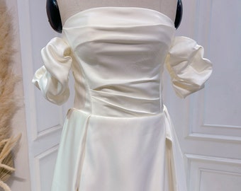 Off-the-shoulder satin wedding dress. A-line style bridal wedding dress. Custom wedding dresses.