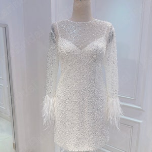 Sparkly short wedding dress. Long sleeve feather wedding dress. Mini bridal dress. Custom wedding dresses for brides.