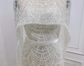 Sparkling wedding dresses and gowns, Luxurious pearls and sequins wedding dresses. Custom wedding dress for the bride.