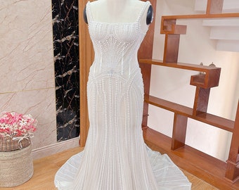 Luxurious pearl wedding dress. Beaded wedding dress with corset. Custom wedding dresses for brides