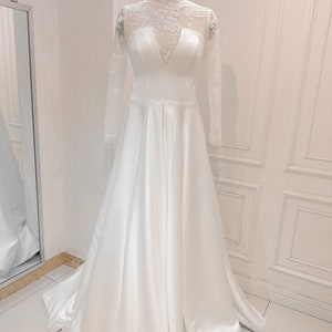 A line wedding dress with high neck and long sleeves with unique lace pattern, custom made wedding dress according to individual sizes.