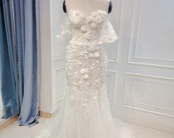 Off-the-shoulder 3D floral lace wedding dress with tulle. Custom made bridal wedding dress made to individual measurements.