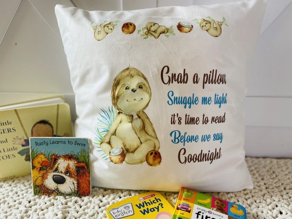Pillow for children with a very cute sloth. Pillow says "Grab a pillow snuggle me tight, it's time to read before we say goodnight".