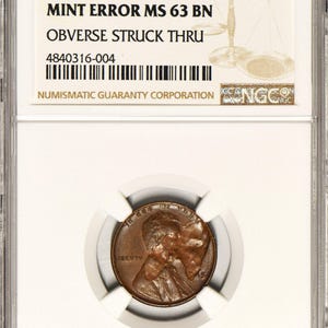 1945 Lincoln Wheat Cent Obverse Struck Thru Mint Error NGC MS-63