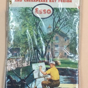 Puede incluir: Mapa de carreteras Esso vintage de 1960, con Delaware, Maryland, Virginia y Virginia Occidental. La portada muestra a un pintor trabajando cerca de un edificio histórico. El mapa está plastificado.